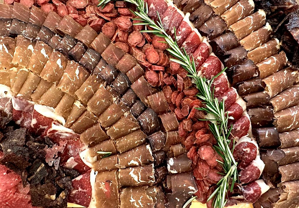 A close up of various meats and vegetables