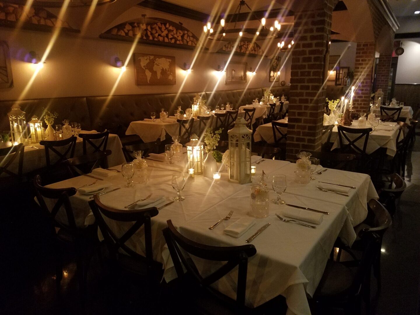 Main Room Event Space 3 A restaurant with tables and chairs set up for dinner.